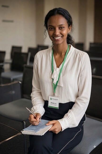 Perago education program participant with a notebook